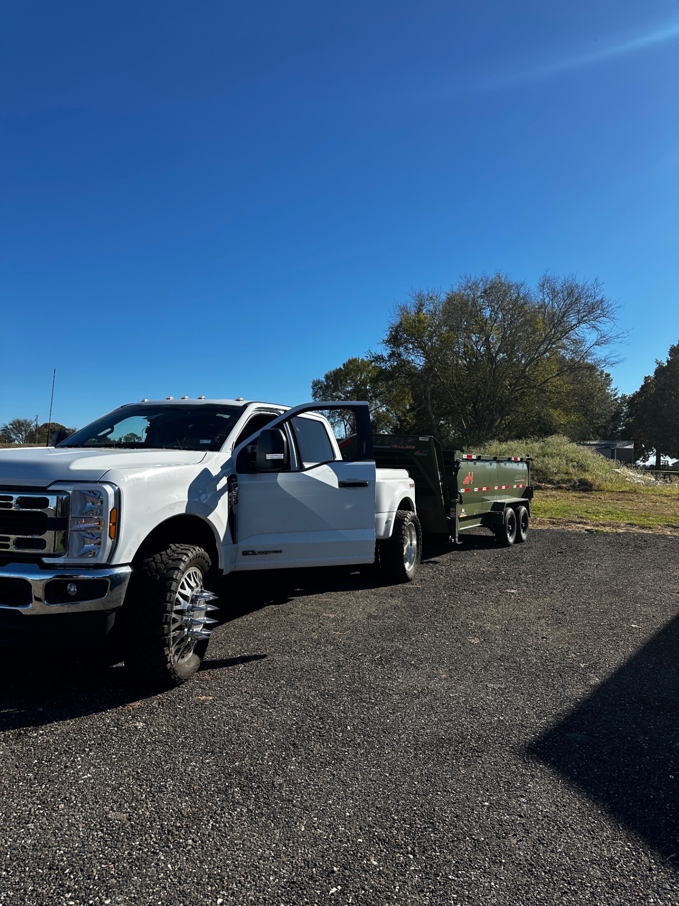 Dump truck unloading on a Texas job site